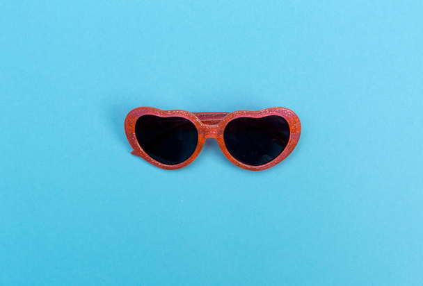 Cool sunglasses on a baby blue background - Photo, image