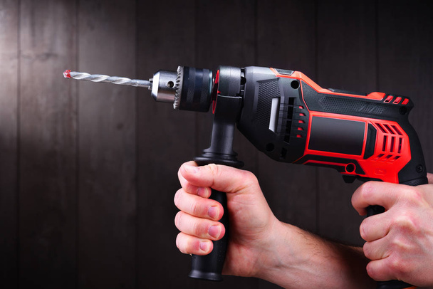 Male hands holding power drill - Photo, Image