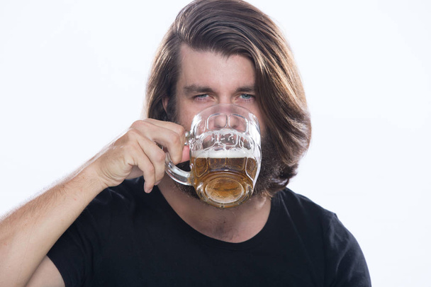 Man with a glass of beer isolated on white, alcohol, harm - Foto, imagen