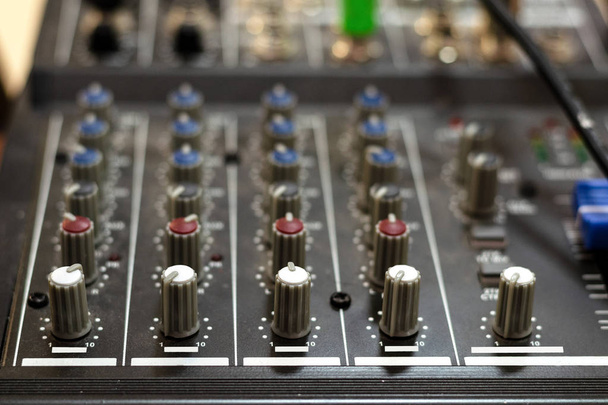 Audio mixing board. Sound mixing console and buttons of mixer co - Photo, Image