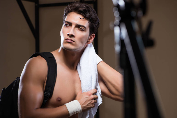 Man tired after workout in sports gym - Photo, Image