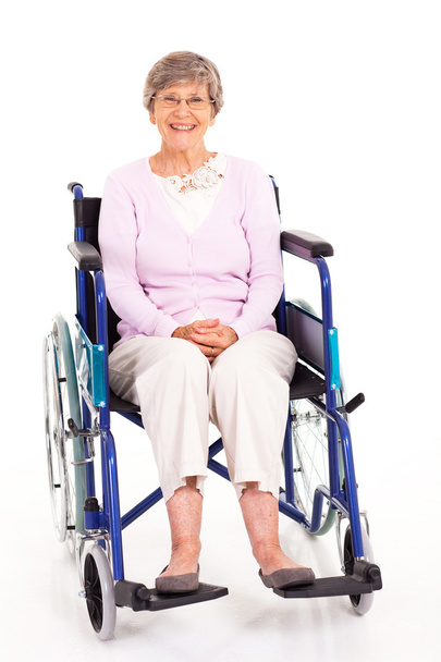 Happy elderly woman sitting on wheelchair isolated on white - Photo, Image