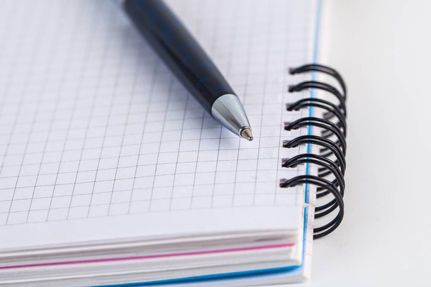 Blue ballpoint pen on the notebook, object - Фото, зображення