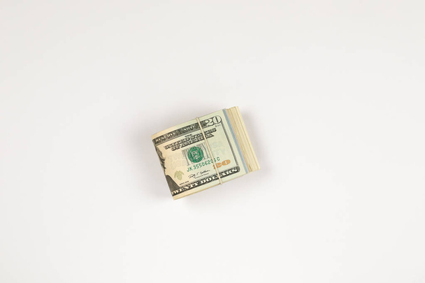 Stack of USA 20 dollars isolated on white background. - Foto, afbeelding
