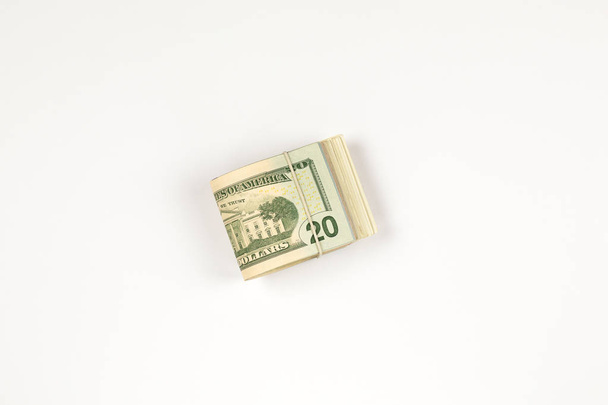 Stack of USA 20 dollars isolated on white background. - Фото, изображение
