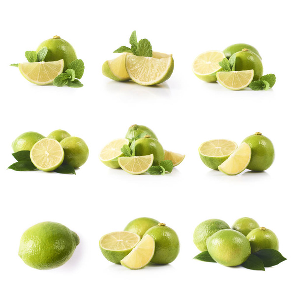 Σύνολο φρέσκα ολόκληρα και κομμένα limes και φέτες που απομονώνονται σε λευκό φόντο - Φωτογραφία, εικόνα