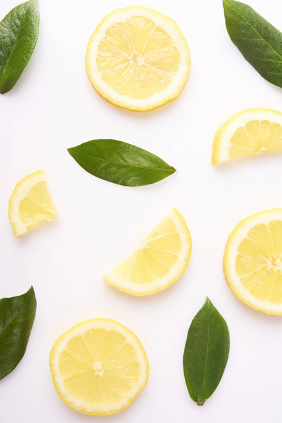 Fresh yellow lemon slices isolated on white background - Fotografie, Obrázek