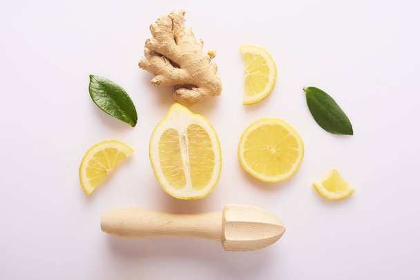 Fresh yellow lemons and ginger root isolated on white background - Foto, imagen
