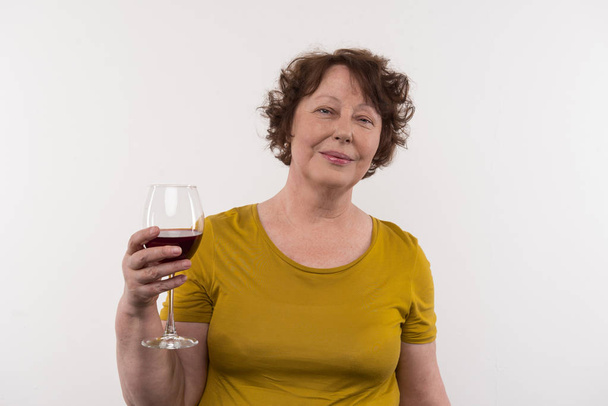 Nice aged woman drinking wine - Foto, immagini