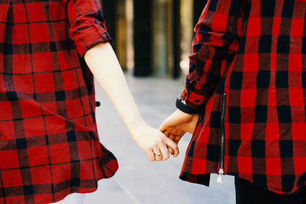 Close up of a couple holding hands - Photo, Image