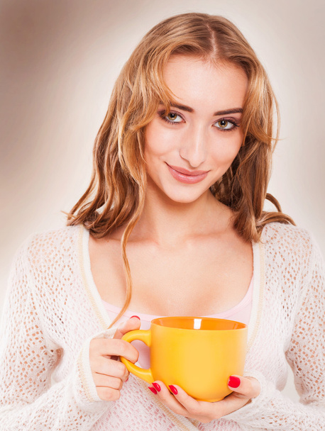 Portrait of cute woman drinking tea or coffee. - Фото, зображення