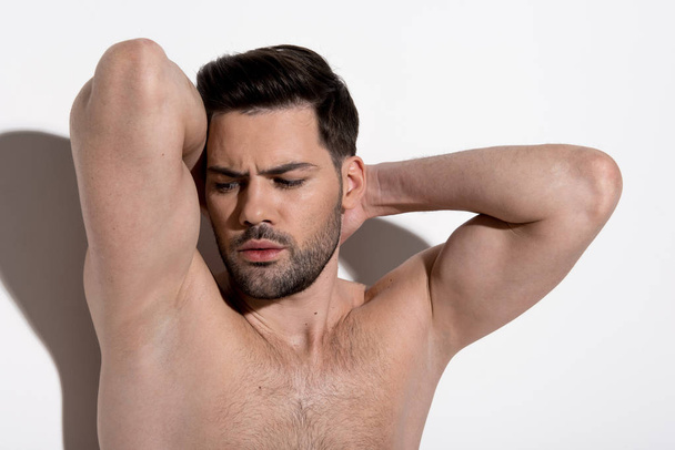 Gorgeous guy is demonstrating his muscular body - Zdjęcie, obraz