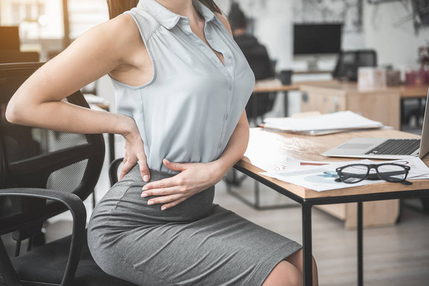 Lady having pain in back - Фото, изображение