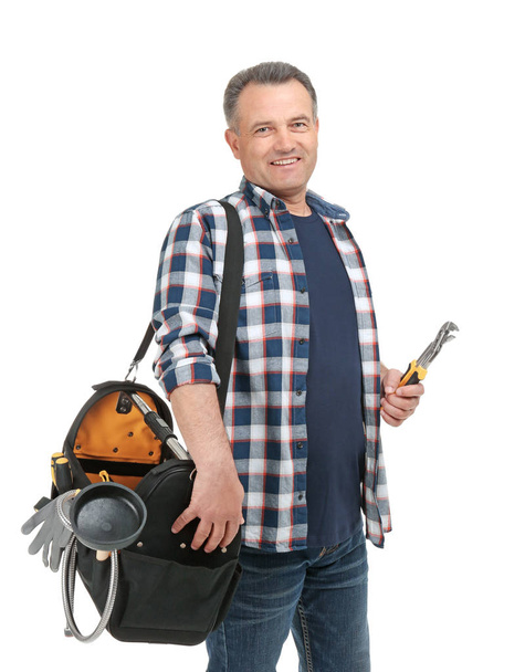 Mature plumber with tool bag on white background - Foto, Imagen
