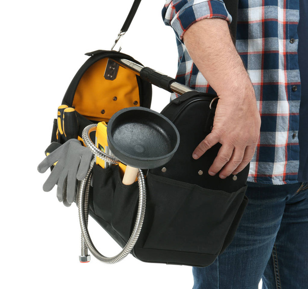 Mature plumber with tool bag on white background, closeup - Foto, Imagen