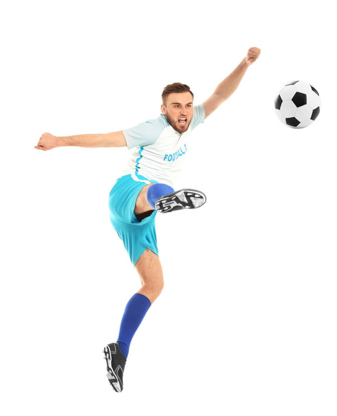 Young man playing football on white background - Zdjęcie, obraz