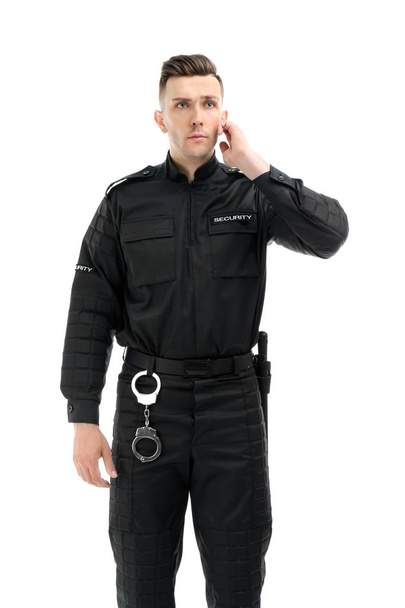Male security guard in uniform on white background - Фото, изображение