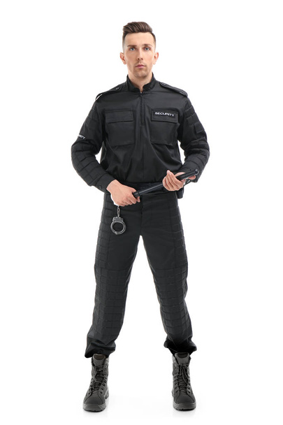 Male security guard with police baton on white background - Foto, afbeelding