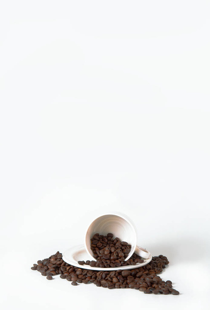 Coffee cup and beans on old kitchen table. Top view with copyspa for your text - Photo, Image