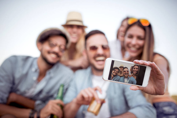 group of friends taking selfie on smartphone outdoors during vacation - Photo, Image