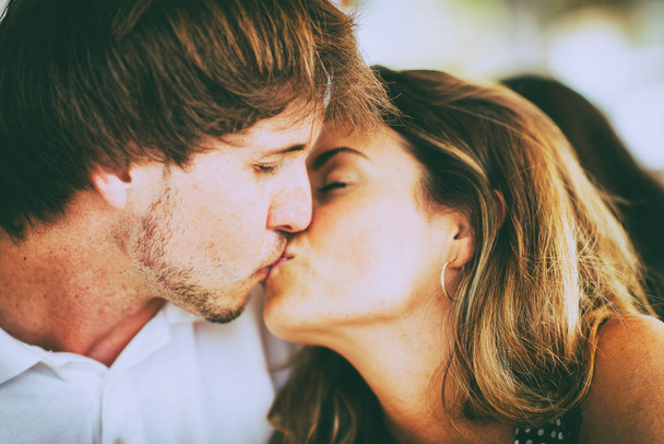 Young couple kissing - Фото, изображение