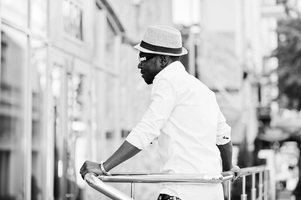 Stylish african american man in white shirt and colored pants wi - Fotoğraf, Görsel