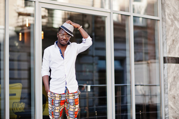 Stylish african american man in white shirt and colored pants wi - Photo, Image
