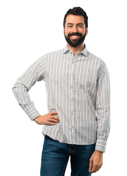 Handsome man with beard posing with arms at hip - Photo, image