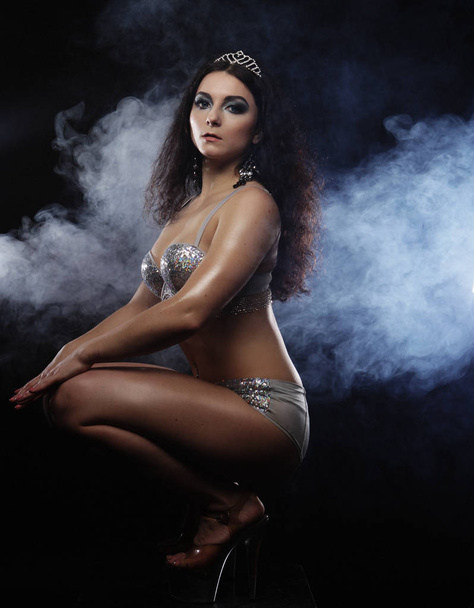 young sexy brunette  woman in lingerie over dark background - Fotografie, Obrázek