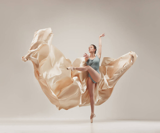 Modern ballet dancer dancing in full body on white studio background. - Φωτογραφία, εικόνα