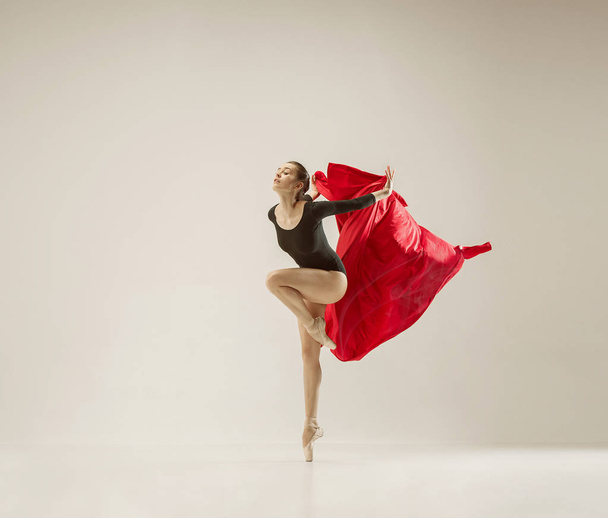 Modern ballet dancer dancing in full body on white studio background. - Photo, Image