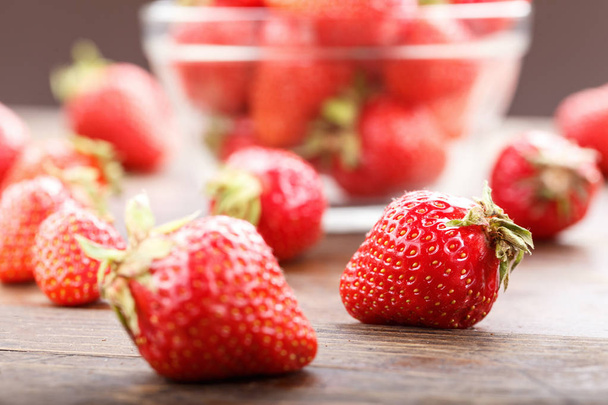 ripe strawberry in a plastic container - Фото, изображение