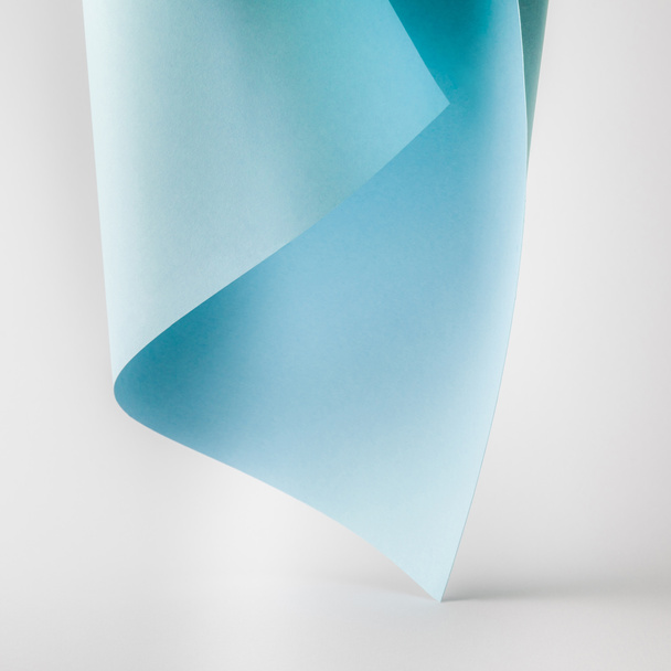 close-up view of tender blue paper sheet on grey background   - Valokuva, kuva