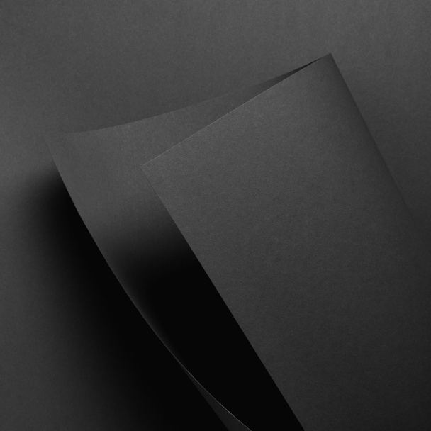 close-up view of grey paper sheet and dark background - Photo, Image
