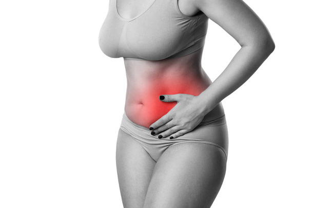 Woman with abdominal pain isolated on white background, ache in left side - Foto, afbeelding