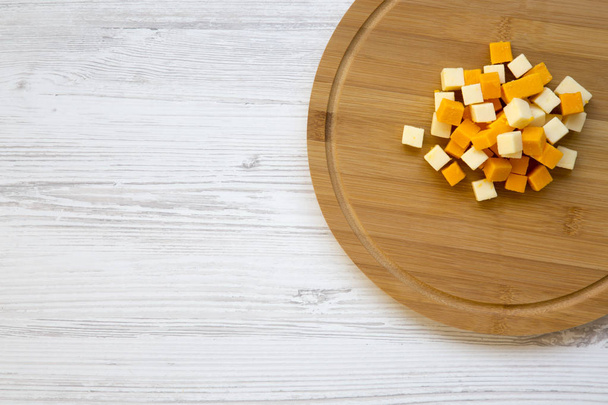 Pieces of mimolette and edam cheeses on wooden board. Top view. Copy space. - Photo, Image