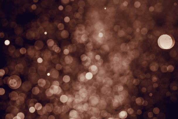 クリスマスボケの背景のテクスチャボケに抽象的な光輝く星。キラキラヴィンテージライト背景 - 写真・画像