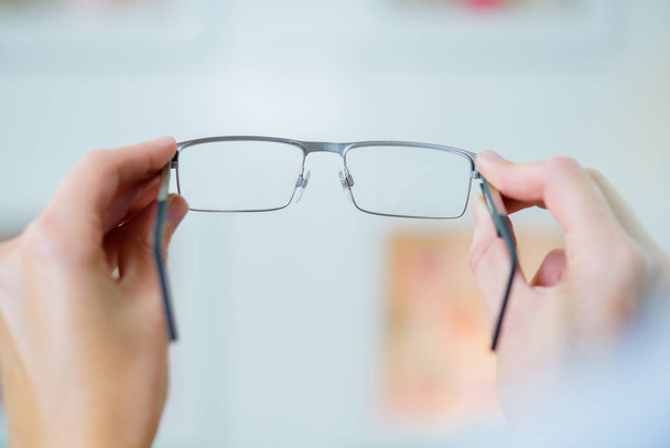 trying glasses at the optician - Photo, Image
