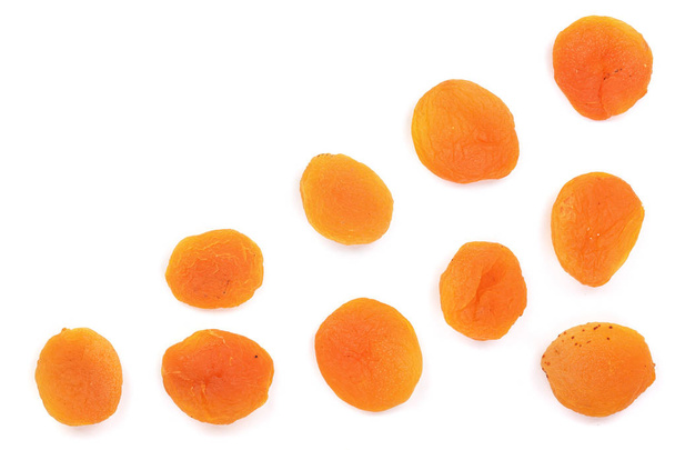 Dried apricots isolated on a white background with copy space for your text. Top view. Flat lay pattern - Zdjęcie, obraz