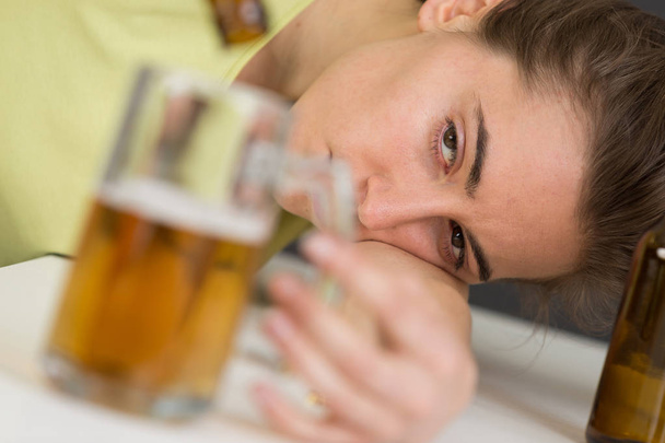 drunk woman with bottle in hand - Zdjęcie, obraz