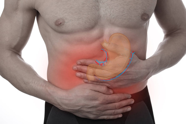 Man with stomach pain. Digestive system problems. - Fotoğraf, Görsel