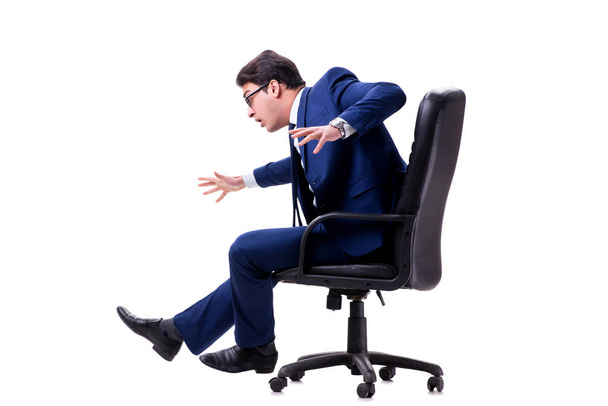 Businessman sitting on office chair isolated on white - 写真・画像