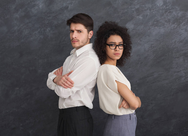 Confident business couple on gray background - Fotó, kép