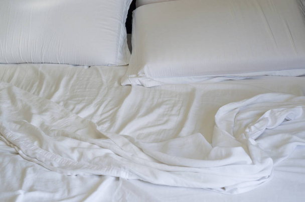 Great concept of bed messy, unkempt, white bed, crumpled sheet. - 写真・画像