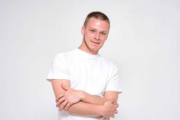 you will succeed and will be ok. Portrait of a confident young handsome man on a white background. He stands directly in front of the camera and smiles - Valokuva, kuva