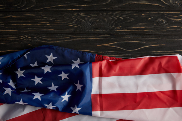 top view of united states flag on wooden surface  - 写真・画像