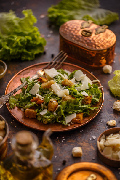 Healthy simple Caesar salad with cheese and croutons - Photo, image