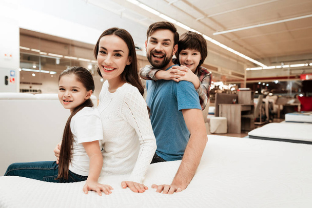 family choosing soft mattress in orthopedic furniture store - Photo, Image