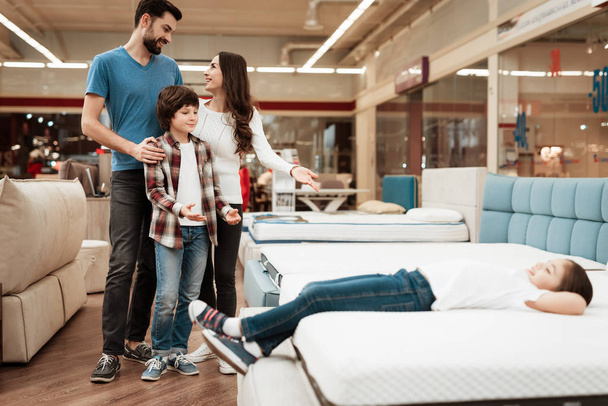 family choosing and buying new orthopedic mattress in furniture store - Photo, Image