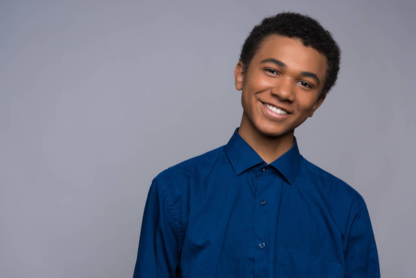 Happy African American teenager in denim shirt. - Foto, Imagem